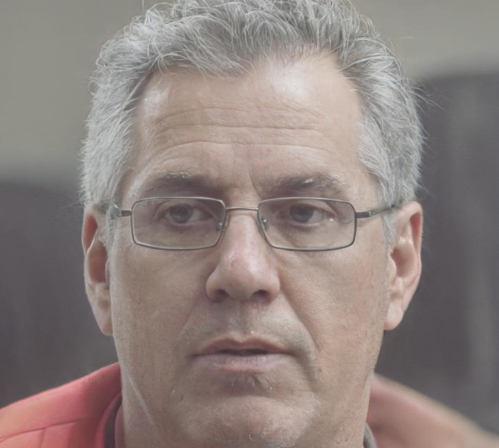 Professional headshot of financial coach Brennan Oakworth